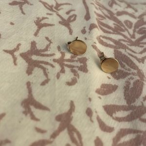 Gold colored circular earrings